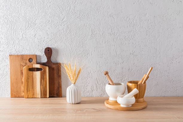 istock Environmentally friendly kitchen utensils and utensils in the kitchen interior on a wooden countertop. front view. Eco style. concrete wall. 1635183494