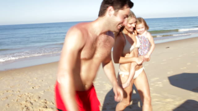 Family Enjoying Beach Holiday Together