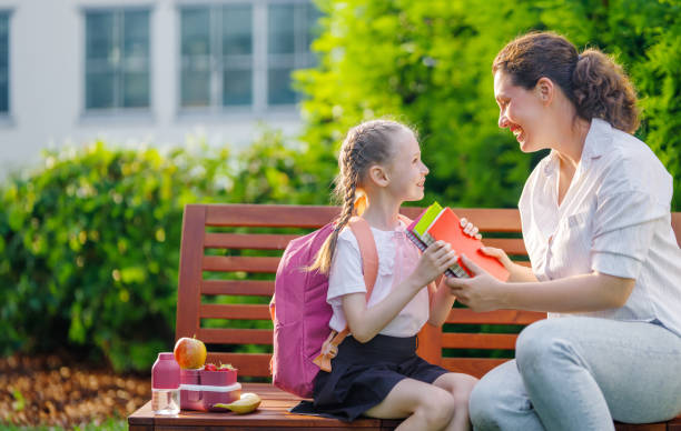 istock Parent and kid going to school 1635197135