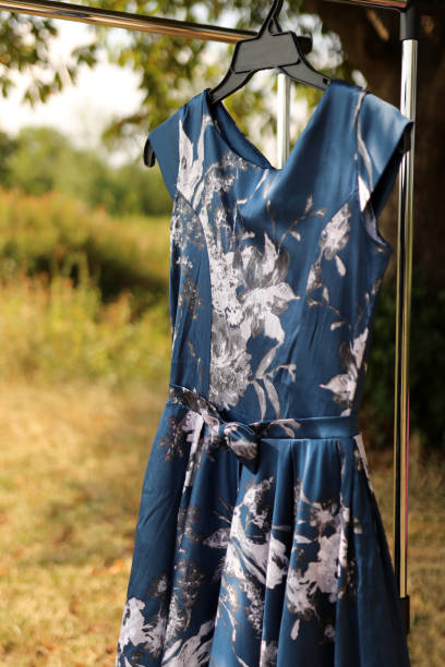 istock A blue robe with a bow hangs on a hanger. 1635197138