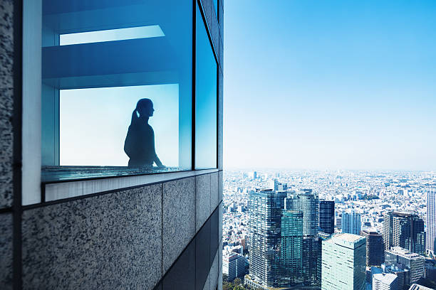 Silhouette of a Woman Overlooking Metropolis