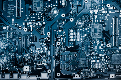 Abstract background with computer circuit board, blue toned image.
