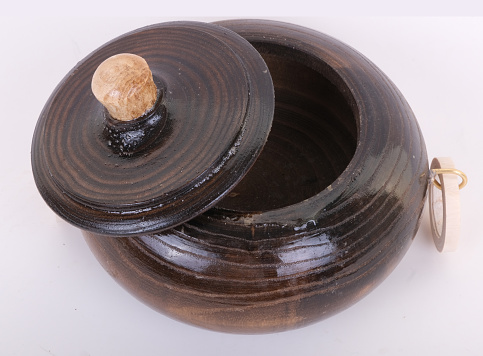 closeup view of quartz stone pebbles balances on a wood plank
