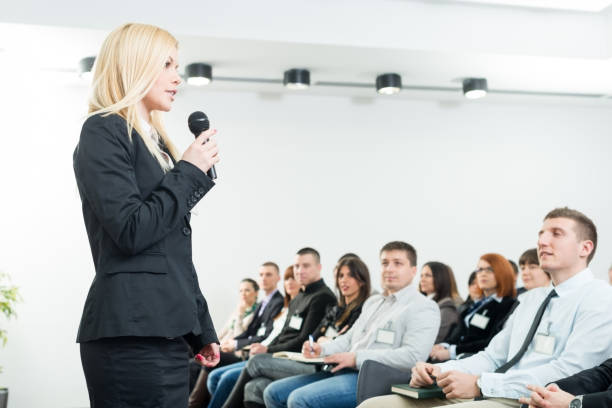 istock Young businesswoman with microphone 163521054