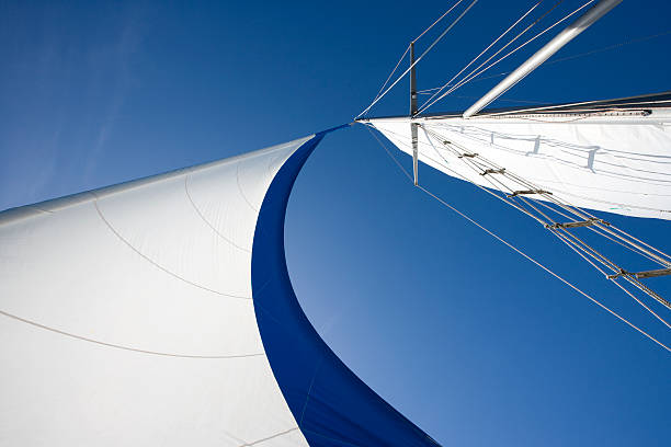 Sailing Wind fills sails on a clear day. sail stock pictures, royalty-free photos & images