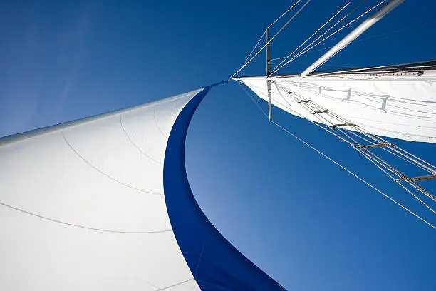 Wind fills sails on a clear day.