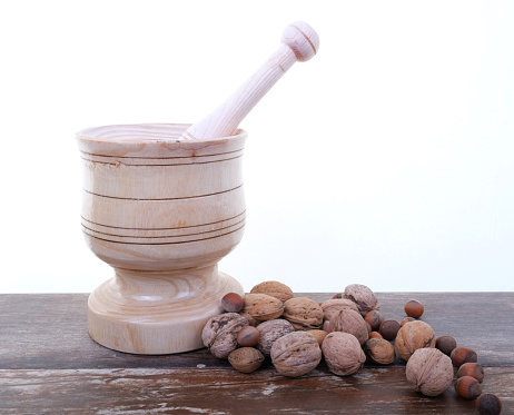 Stone mortar and pestle isolated on white background.