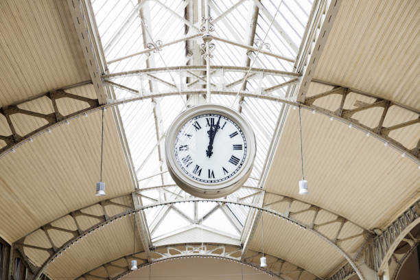 istock ceiling hanging clock, street round roman clock. 12:03 pm 1635216700