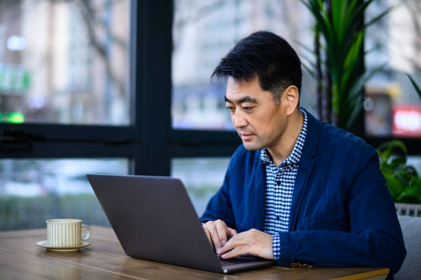 istock Asian middle-aged business man 1635220879