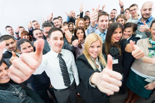 istock Business people holding their thumbs up. 163523561