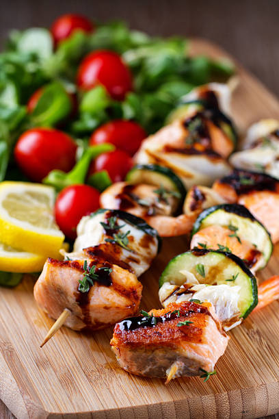 istock Fish skewers with salad 163524838