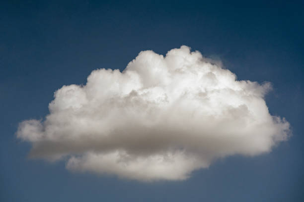 Isolated cumulonimbus cloud floating in the blue sky