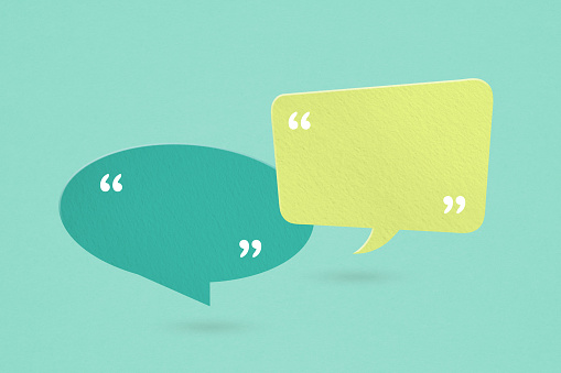 For conceptual image about communication and social media, customer feedback, Blank correspondence light and dark green  grunge paper speech bubbles with quote sign on rough  paper texture