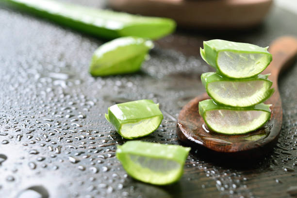 istock Aloe vera slices in spoon at table 1635273424