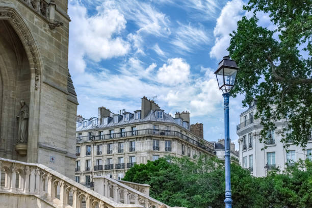 Paris, buildings in the Marais, in the center, in a typical street, with the Saint-Jacques tower