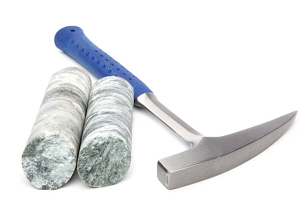 Geologist hammer with 2 inch drill core.