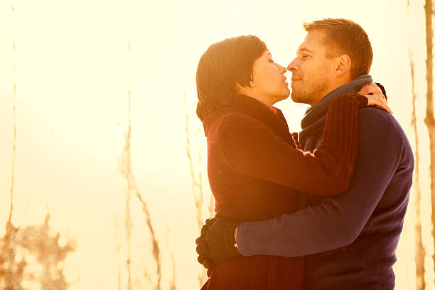 istock couple in love at sunset 163529721