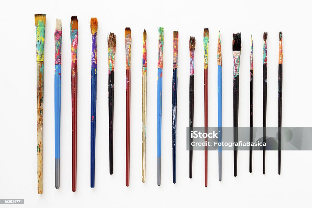 Dirty paintbrushes Several used paintbrushes isolated on white Paintbrush Stock Photo