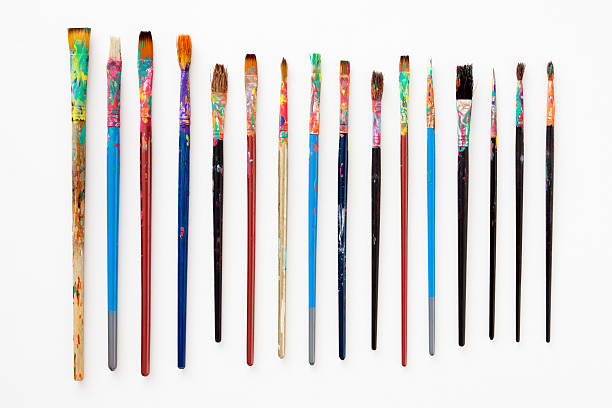Dirty paintbrushes Several used paintbrushes isolated on white art paint brush stock pictures, royalty-free photos & images