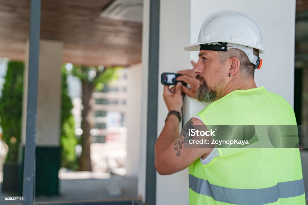 Large Engineering Level Construction Engineer Using A Laser Level To Measure The Distance Stock ...