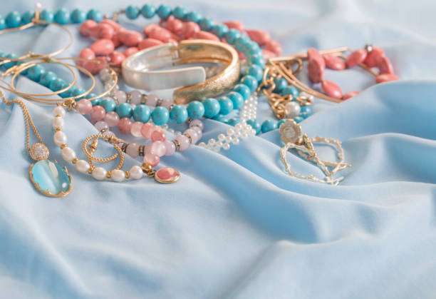 istock different women's jewelry on blue fabric 1635339309
