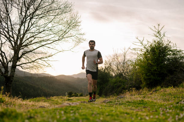 istock Young man running in the mountains 1635340375