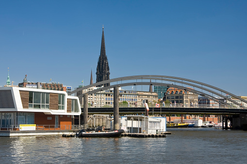 Office Building St. Catherine's Church and Kibbelstegbrücke at customs canal in Hamburg, Germany