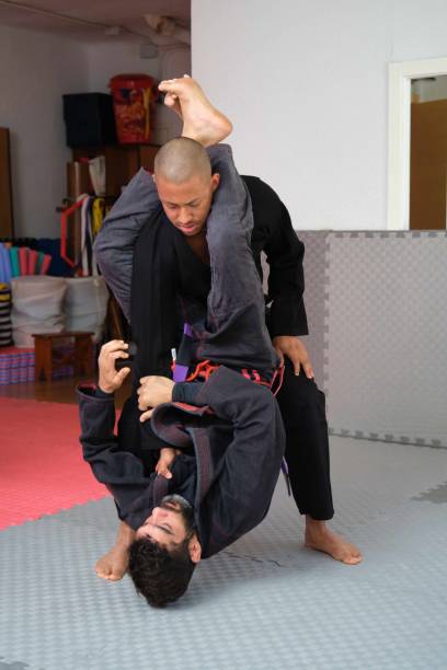 istock Two men practicing Brazilian Jiu-Jitsu sparring at the Academy. 1635357246