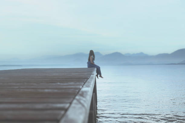 istock woman enjoys a breathtaking view colored in a surreal blue 1635408499