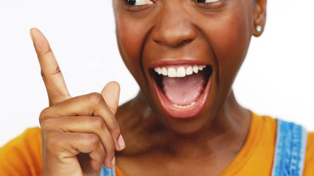 istock Hand, idea and breakthrough with an african female feeling excited while contemplating a thought. Thinking, wow and lightbulb moment with a black woman in studio isolated on a white background. 1635408637