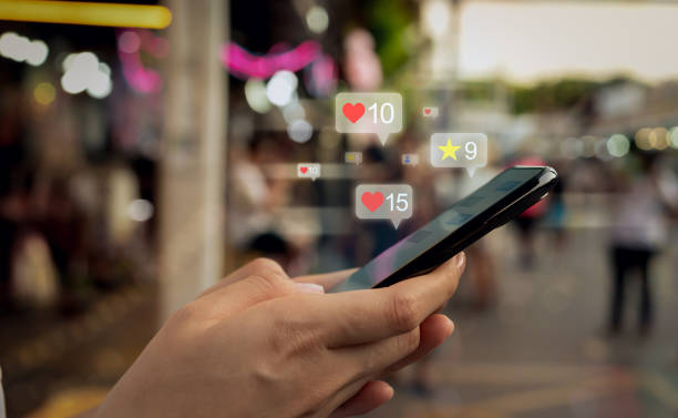 istock Hands holding smartphone with using a social media on mobile, typing message and comment to communicate. 1635417142
