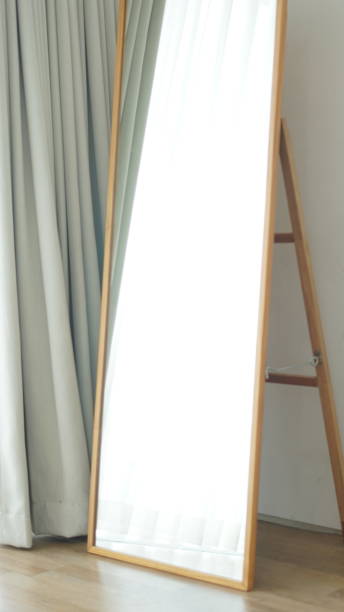 istock An mirror with sun reflecting and wood floor panel creating minimalistic feeling 1635418225