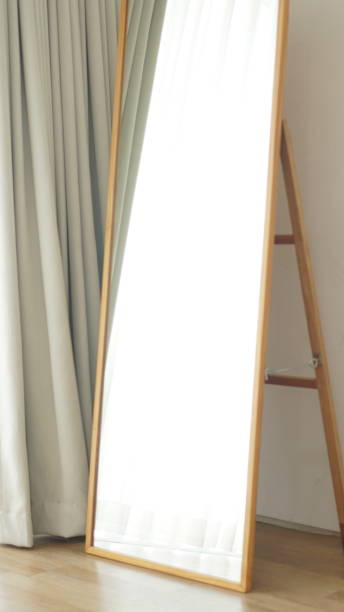 istock A mirror with sun reflecting and a wood floor panel create minimalistic feeling 1635418227