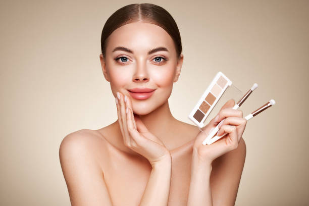 istock Beauty woman with eye shadow makeup palette 1635422475