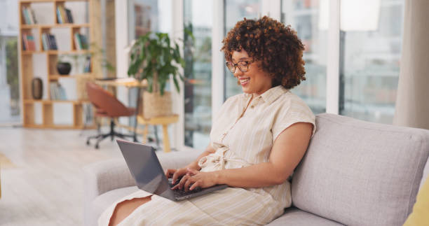 istock Startup, woman on couch and laptop for remote work from home, connection and typing for data analysis. Female entrepreneur, happy freelancer and consultant in living room, device and website launch 1635466961