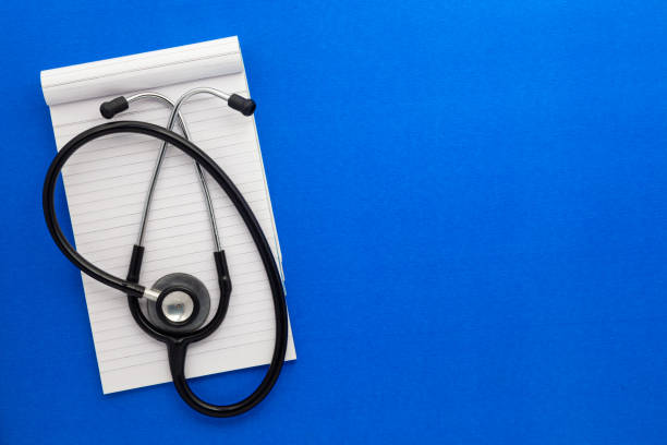 istock Top view of a open notebook with Medical stethoscope. 1635467134