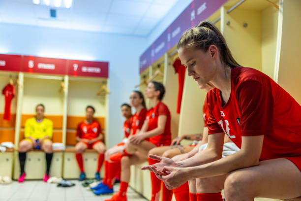 istock Thoughtful football player in dressing room 1635482549