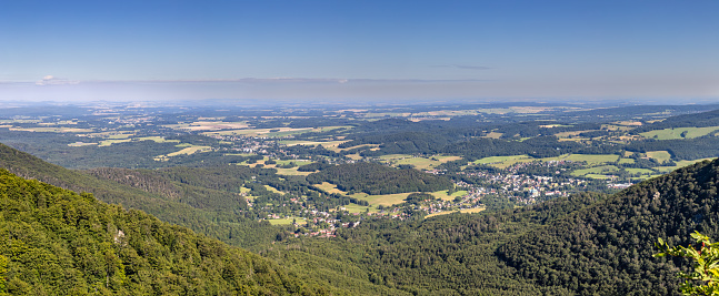 Panoramic shot from hill peak to valley with villages under summer blue sky - Jizera Mountains, Czech Republic, Europe