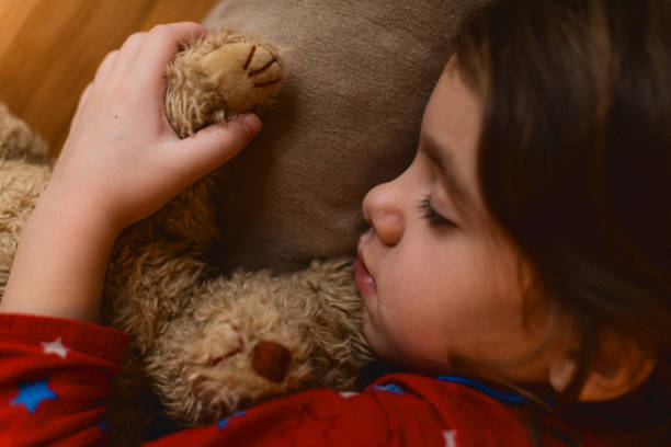 istock Little girl sleeping on a pillow 1635538292