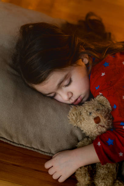 istock Little girl sleeping on a pillow 1635539364