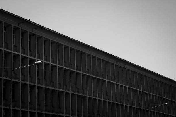 istock Two lamplights and an old office building. 1635540415