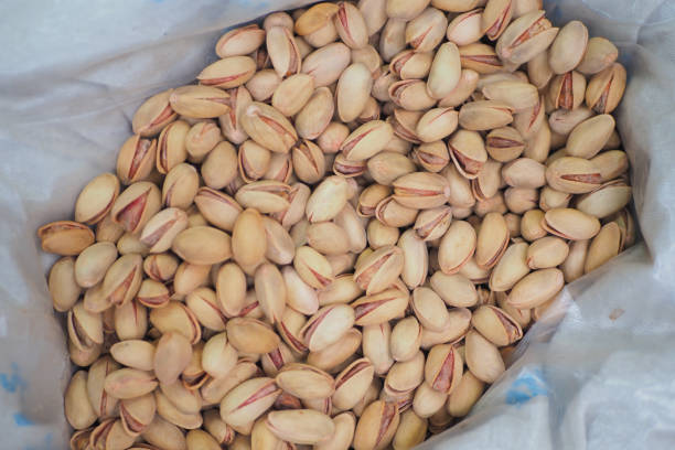 istock A pile of cashew nuts in a white sack. 1635551262