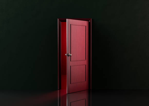 dark and spooky room with a red door half open and light coming out of it. concept of halloween arrival. 3d rendering