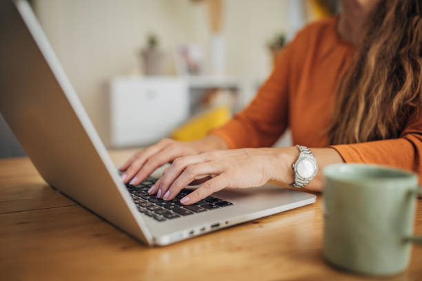 istock Woman freelancer working on laptop at home 1635590639