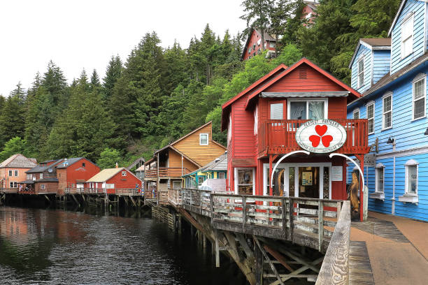 Ketchikan, Alaska, USA - July 11, 2023:  Historic Creek Street, a hugely popular historic area. Mounted on stilts, the street is a boardwalk with shops, restaurants and eagles perched above.
