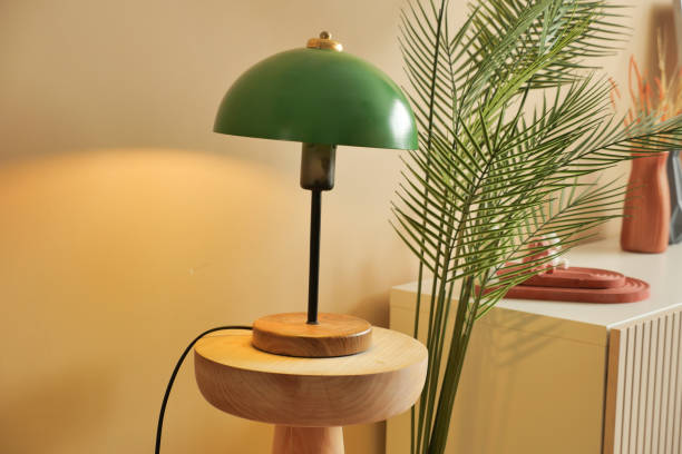 istock a table glowing lamp in home against orange color wall 1635593905