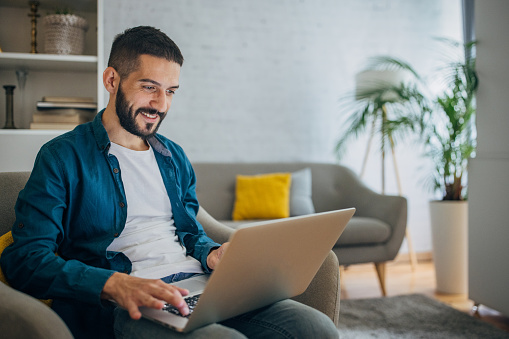 Man working on laptop at home