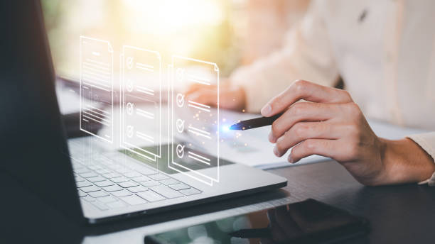 istock Businessman checking the steps through a virtual online document with a list of checkboxes Concepts of practices and policies, company articles of association Terms and Conditions 1635608180