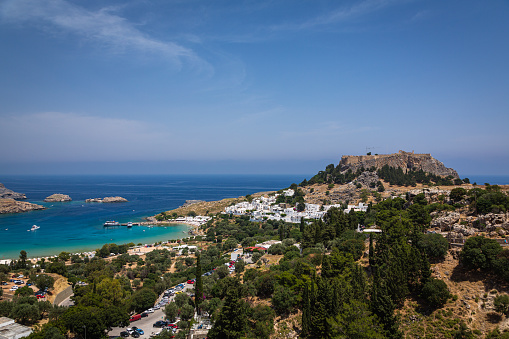 Lindos is a charming village on Rhodes, Greece. It's known for its ancient Acropolis, beautiful beaches, and traditional whitewashed buildings. The village offers a mix of history, stunning views, and a relaxing atmosphere.