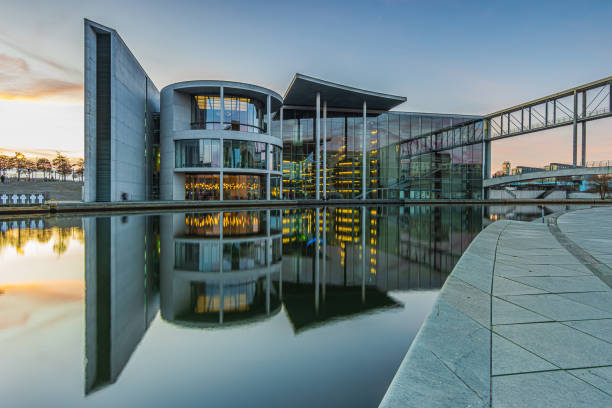 istock Buildings in Berlin at sunset with reflection 1635623547